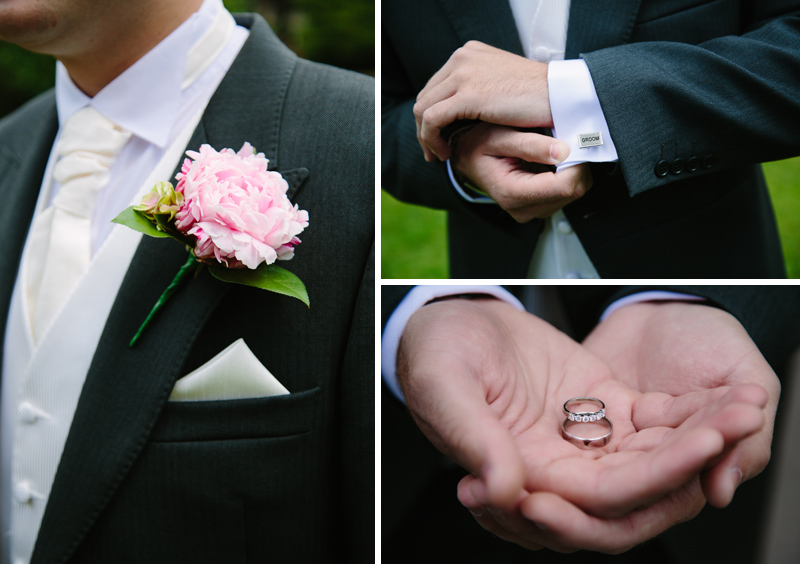 Groom holds wedding rings