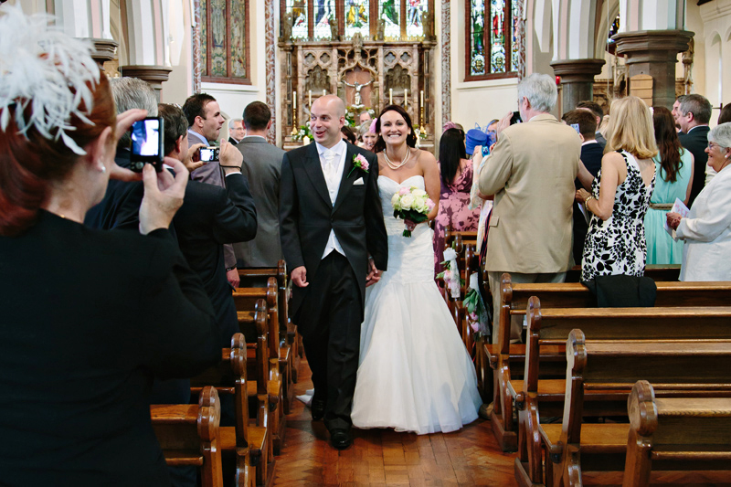 After the wedding ceremony the Bride and Groom exit the church