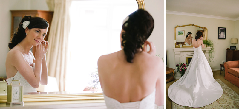 Bride adjusts her earings 