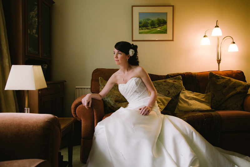 Bride sitting on the sofa thinking