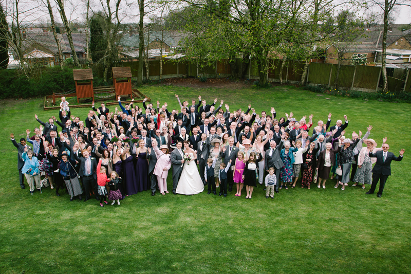Bride and Groom with their guests waving