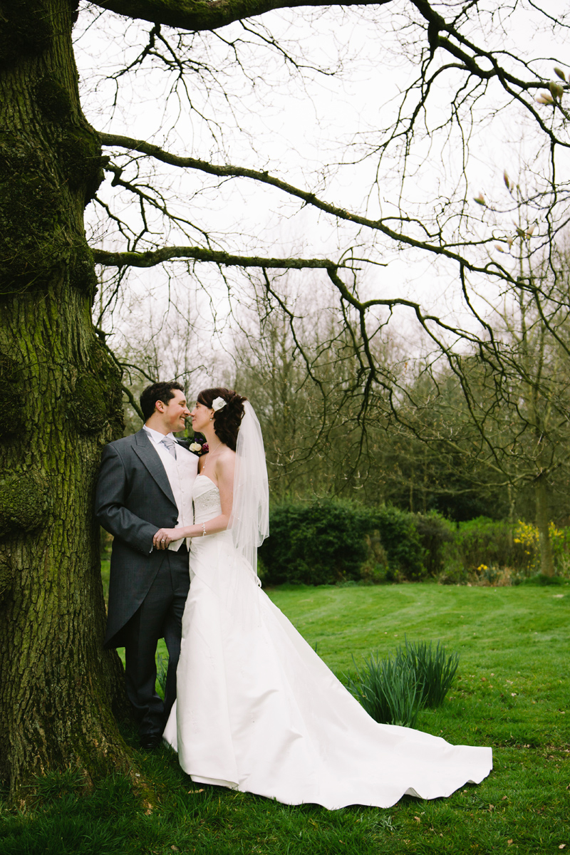 Bride and Groom hold hands and share an intimate moment